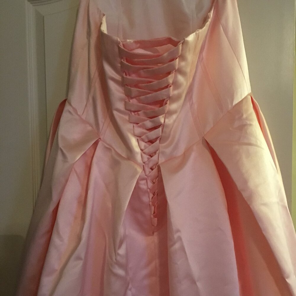 Beautiful Soft pink corset style bridal dress with train. Never worn.